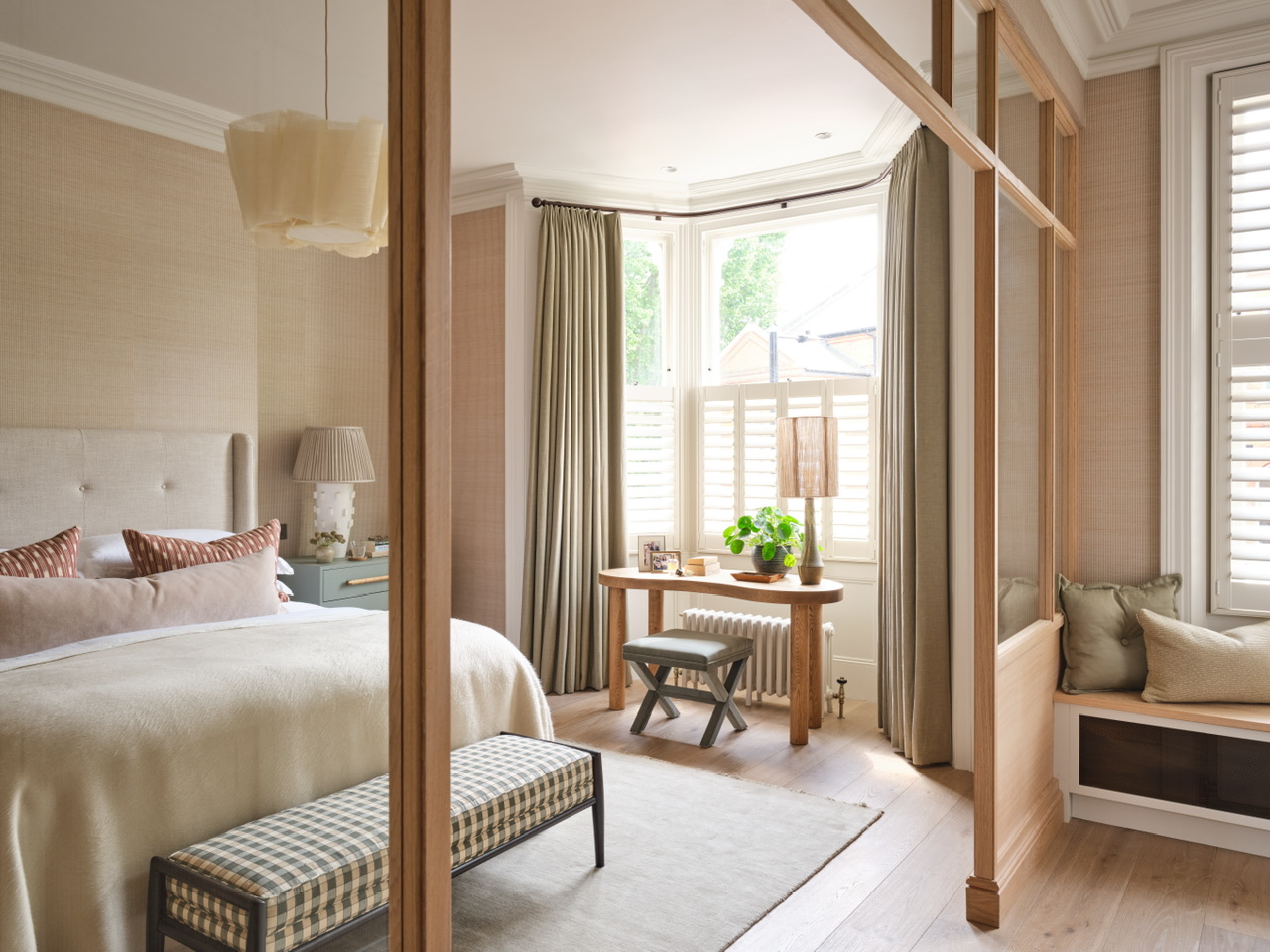 Principal bedroom with glazed internal screen and bay window seat