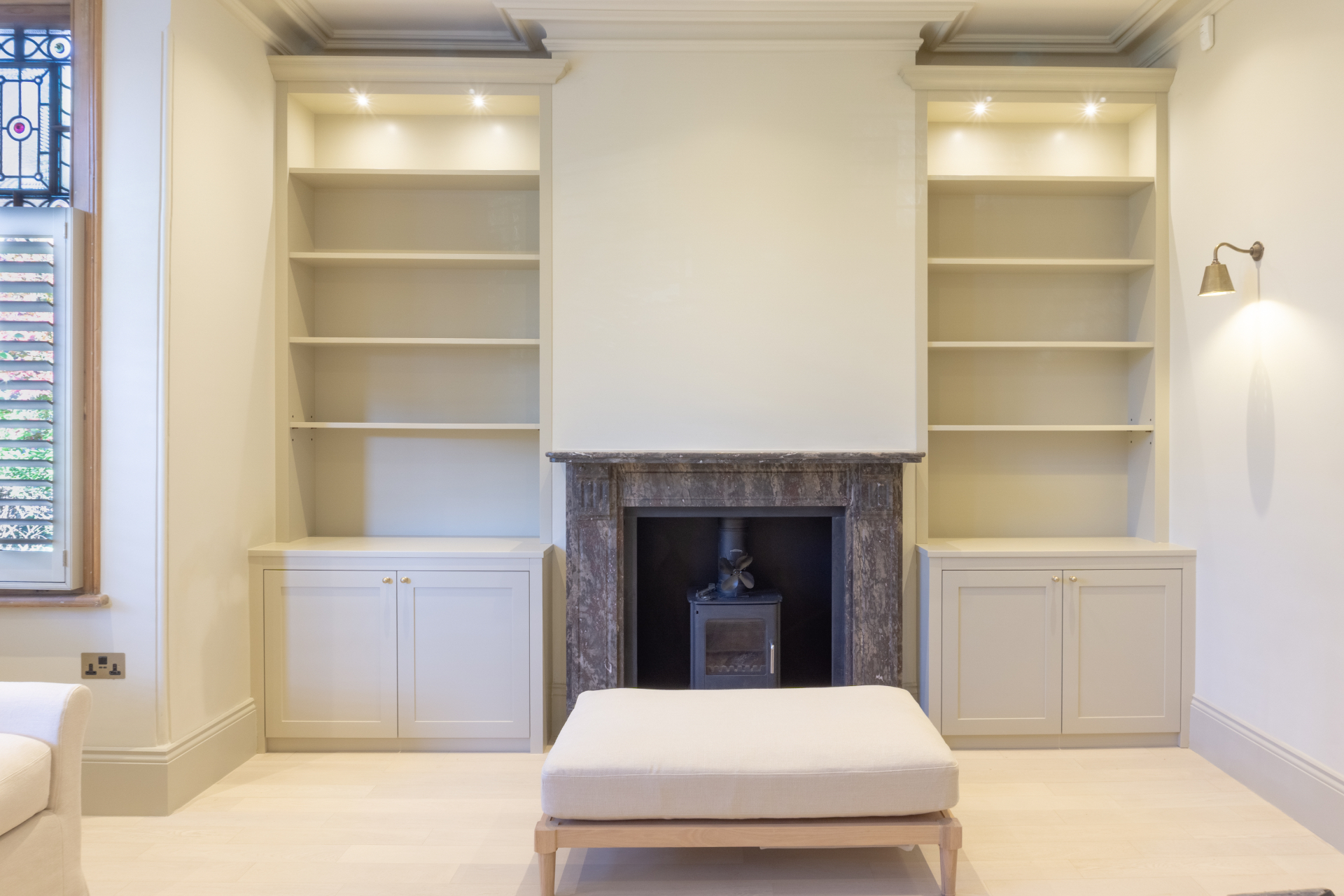 Restored reception room with marble fireplace and bespoke joinery