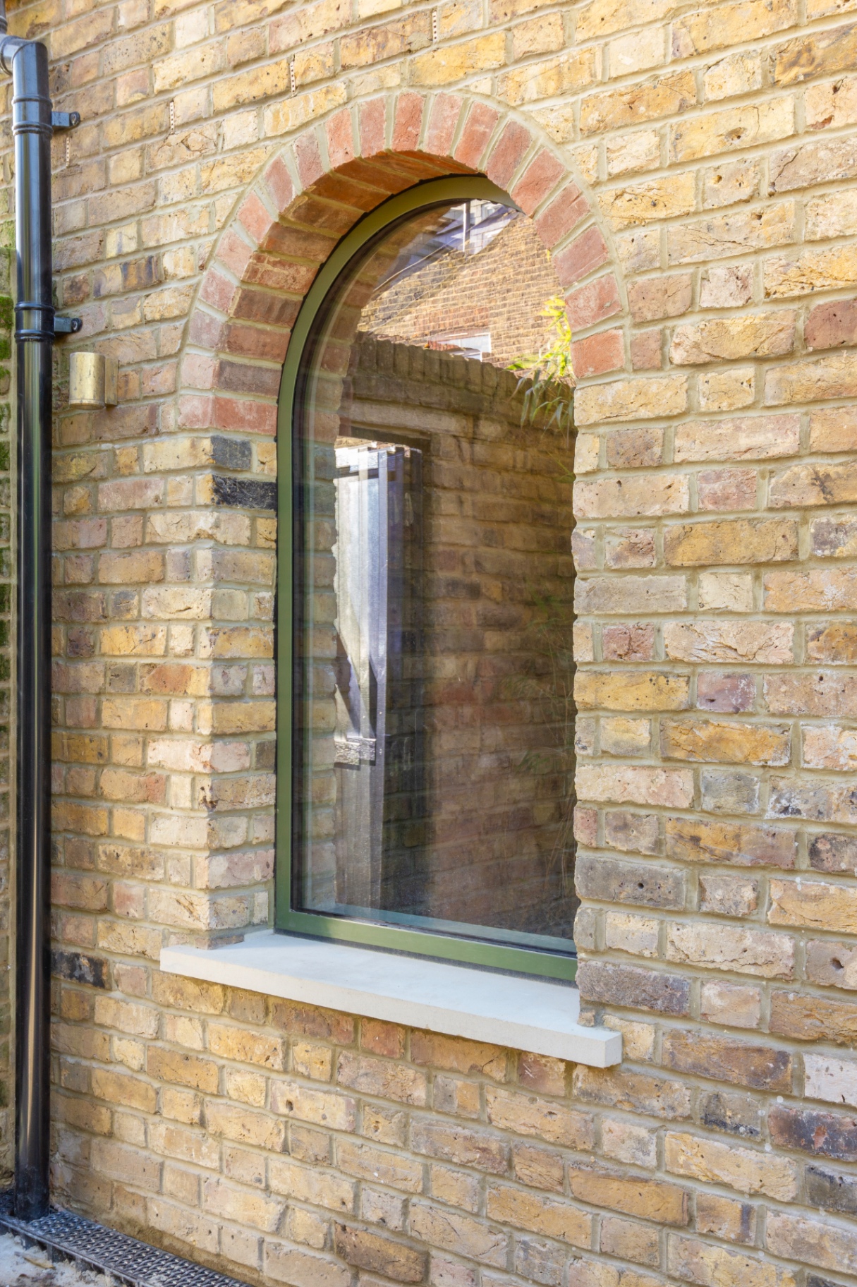 Retained brick arch window to the rear elevation