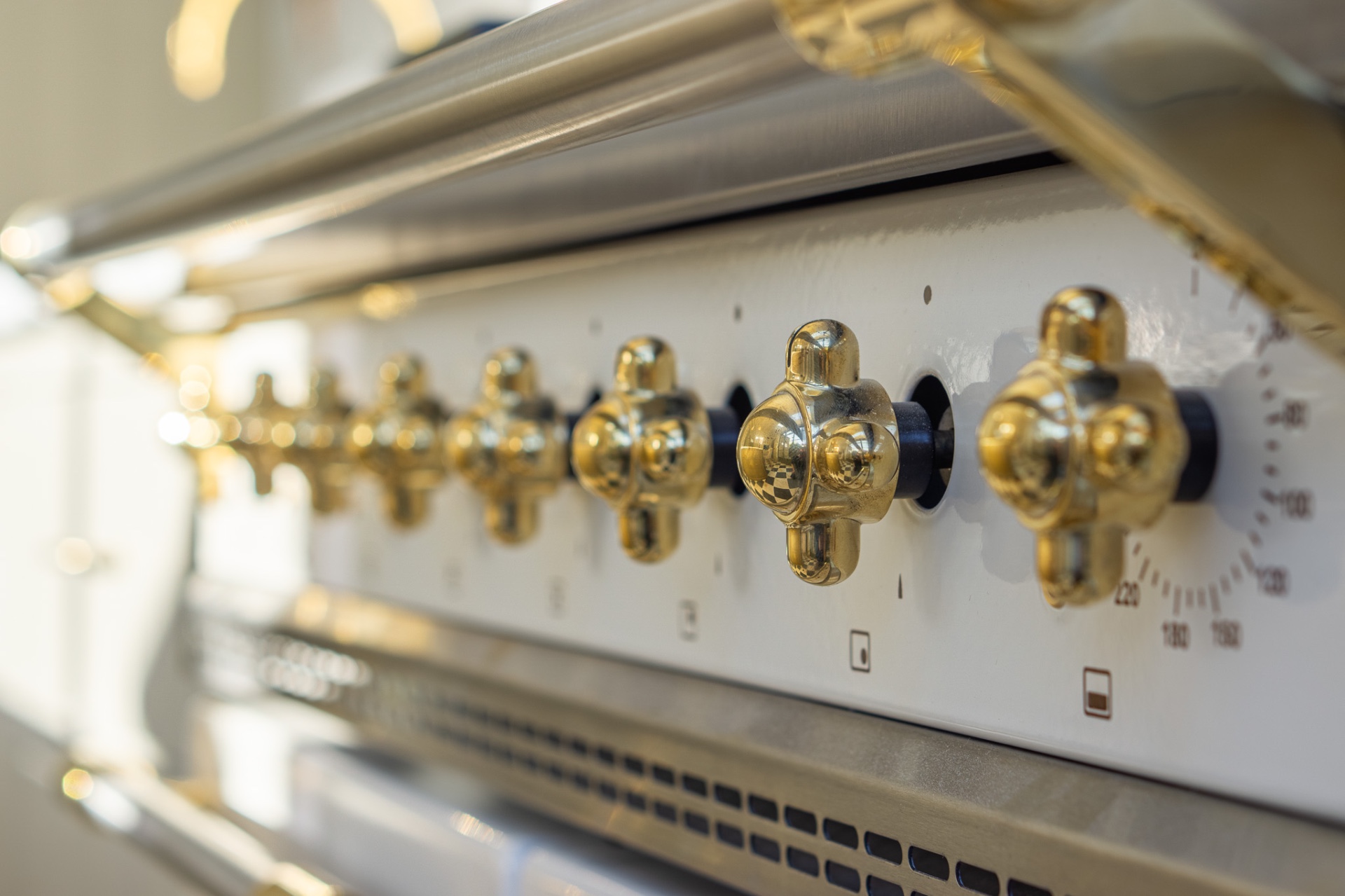 Detail of range cooker with brass controls